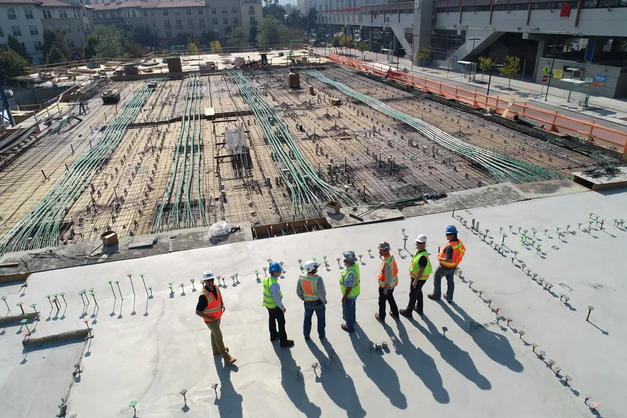 PrimeCraft engineers inspecting a foundation on site